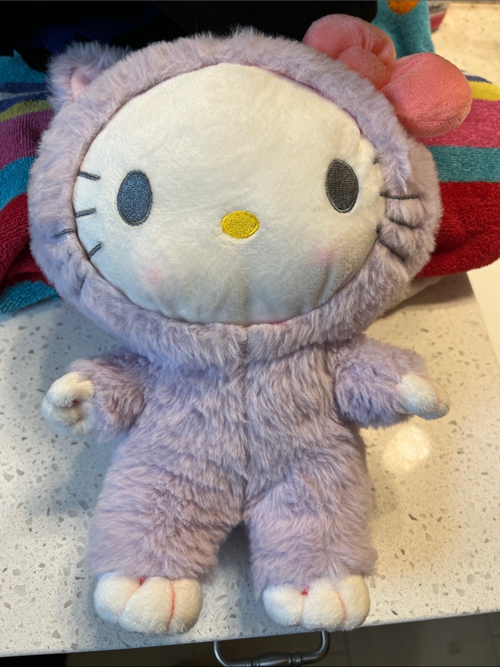 Sanrio Hello Kitty Plush in Lavender Furry Outfit with Pink Bow